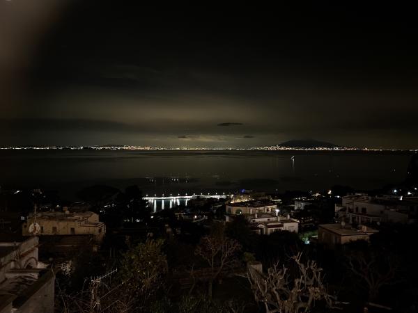 At night, across the bay from Ischia to Naples and Vesuvius.